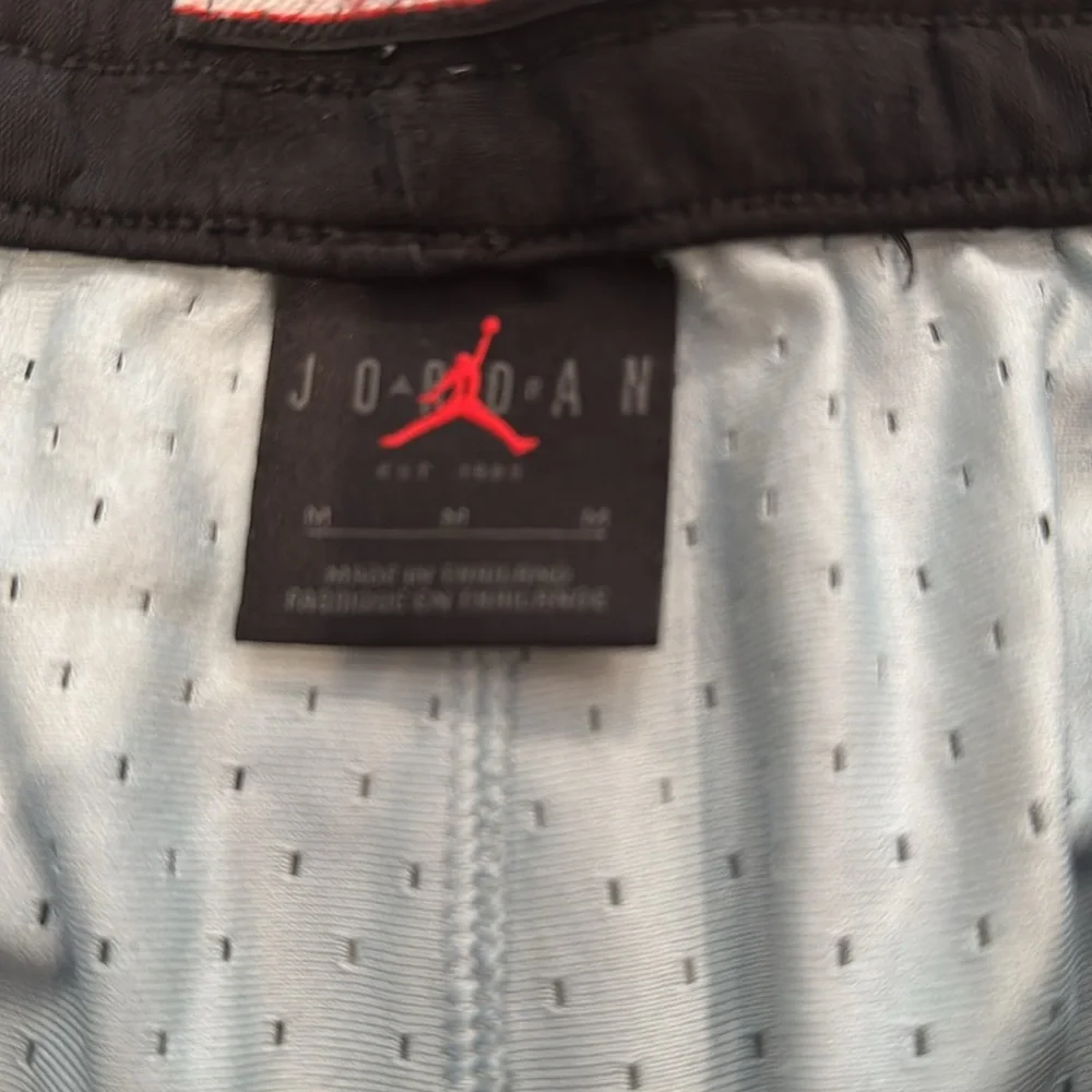 Jordan Men’s Light Blue Mesh Basketball Shorts with Black & White Accents